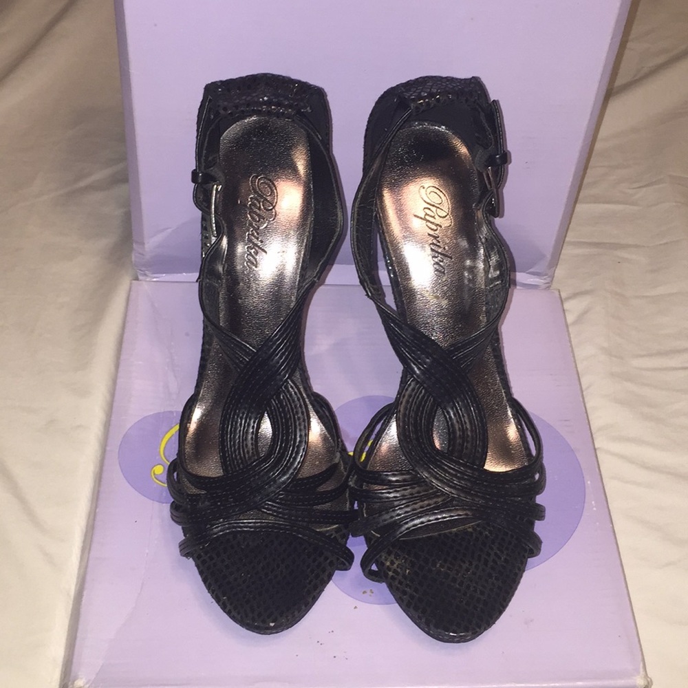 Black high heels with straps.